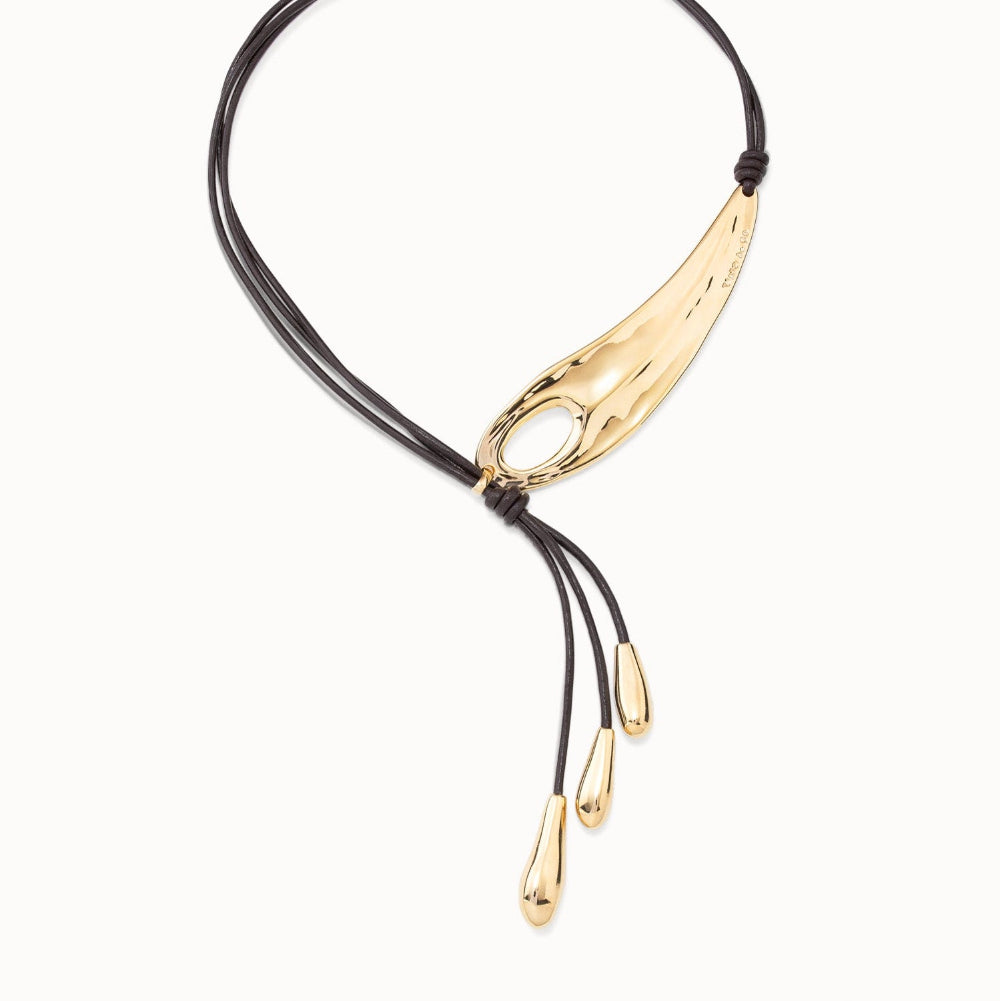 Necklace with black cord and gold accents on a white background