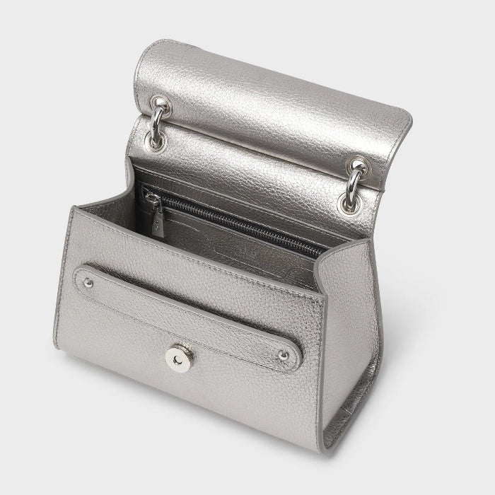 Silver handbag on a light gray background