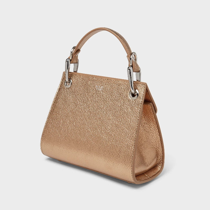 Gold handbag with silver hardware on a light gray background