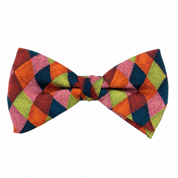 A pre-tied bow tie featuring a vibrant multicolor argyle pattern with diamonds of orange, pink, lime green, and navy blue on a white background.