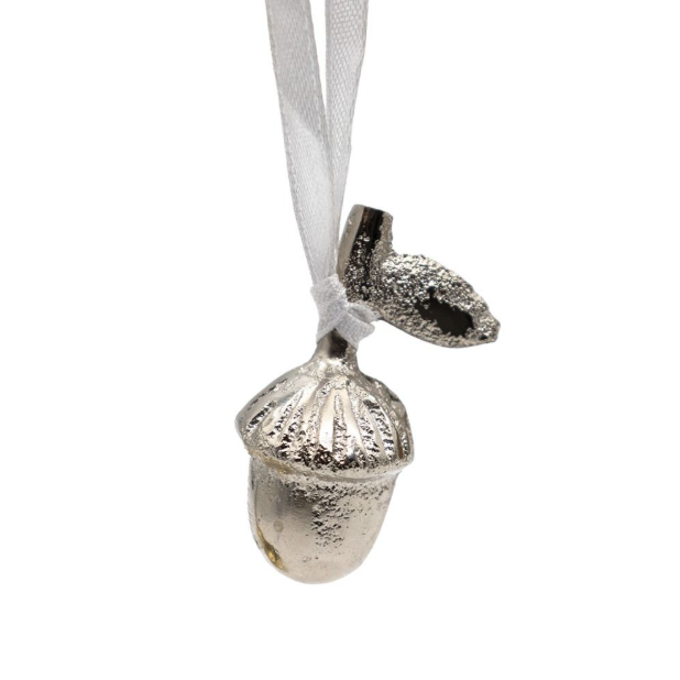 A silver acorn ornament with a textured metallic finish, hanging from a white ribbon on a plain white background.