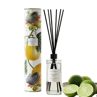 Reed diffuser with packaging featuring fruit design on a light surface.