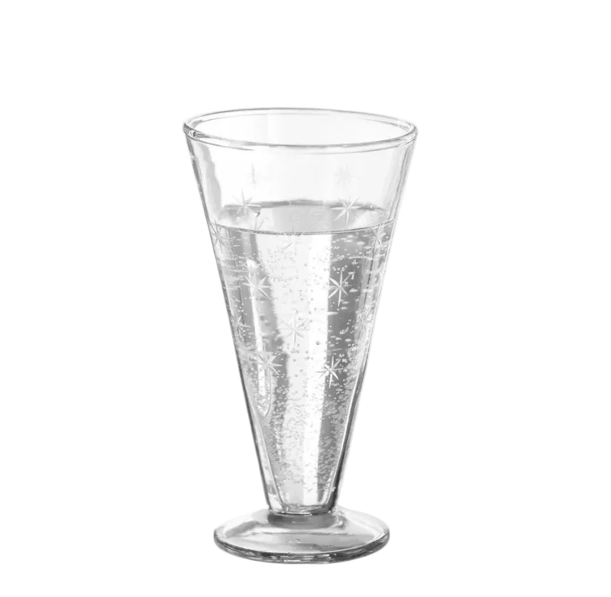 A clear glass tumbler with a flared rim and footed base, decorated with etched snowflake patterns, shown on a white background.